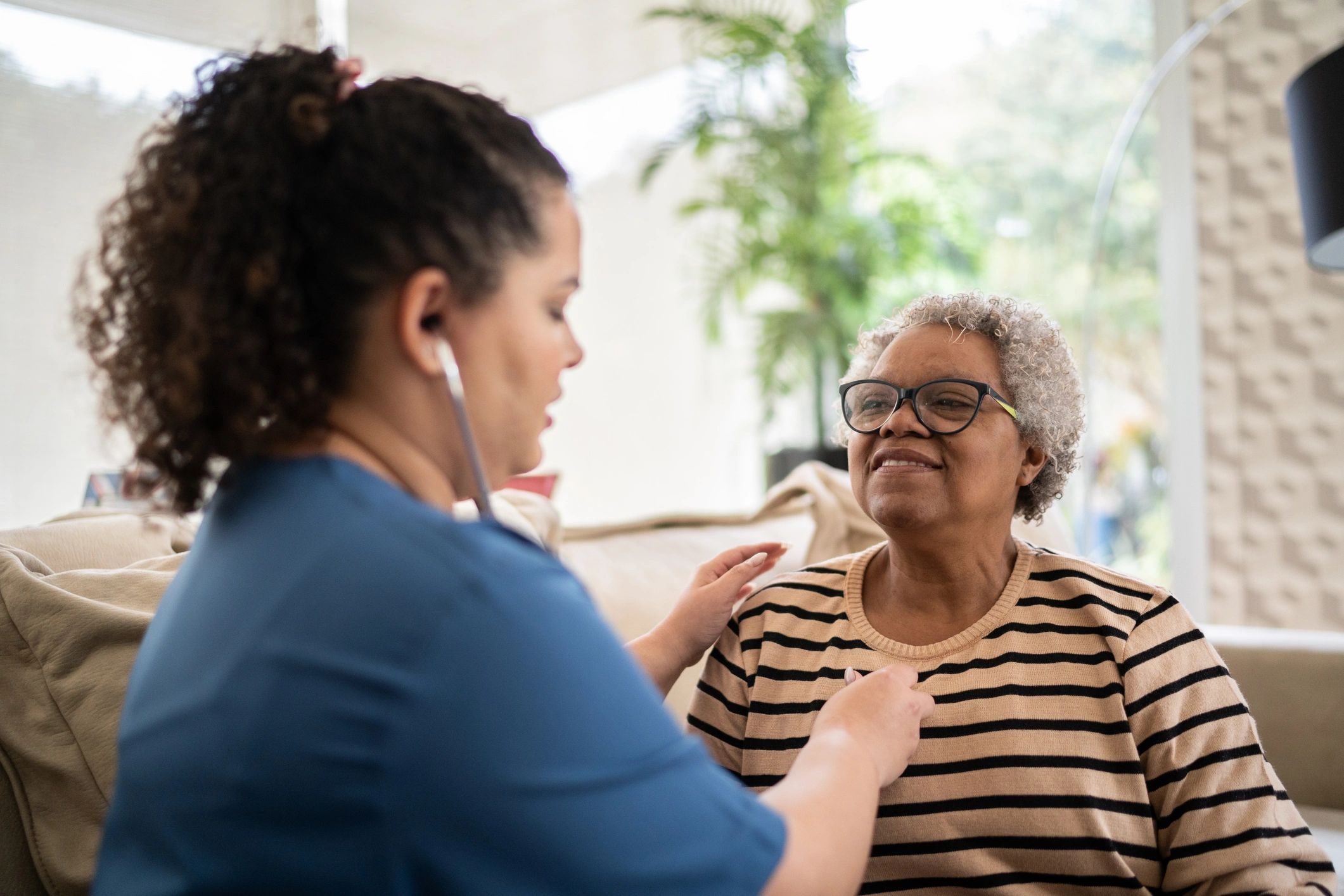 Healthcare professional providing supportive in-home care